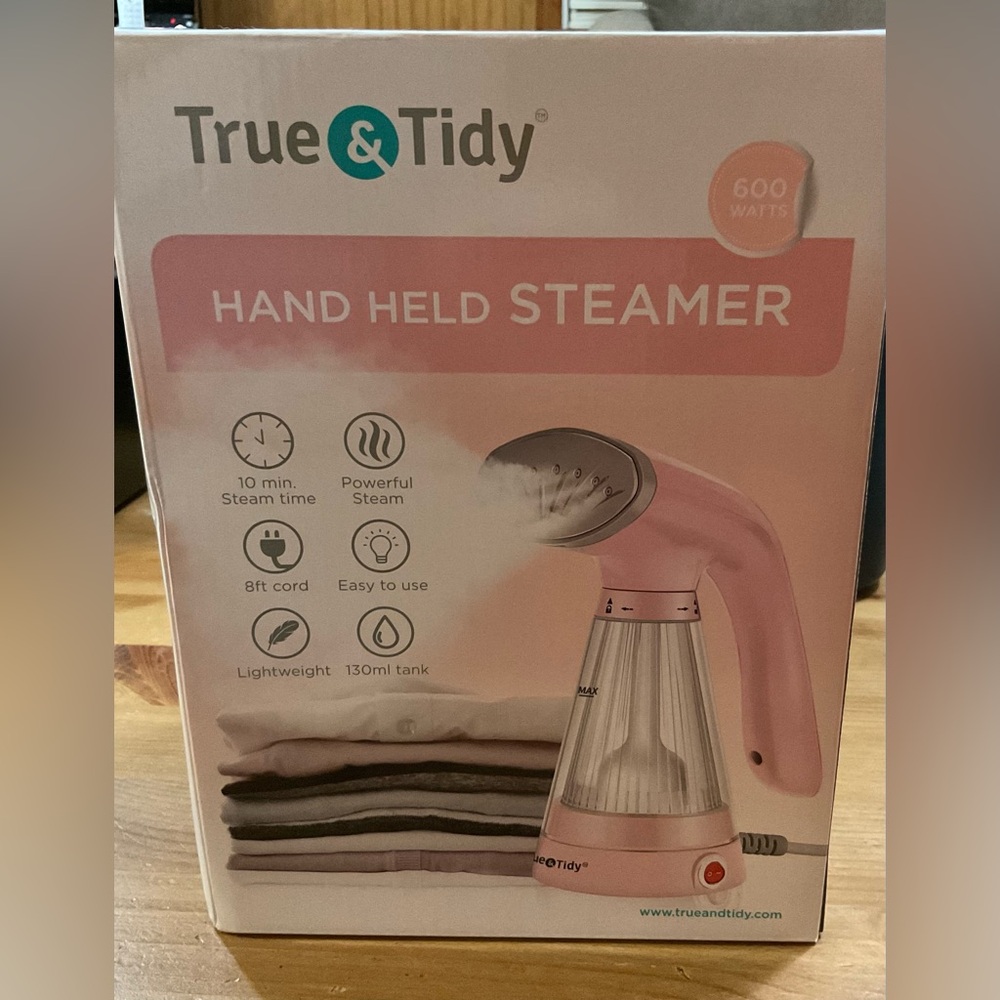 True & Tidy: Light pink Hand held steamer 600 watts easy to use steamer in box.